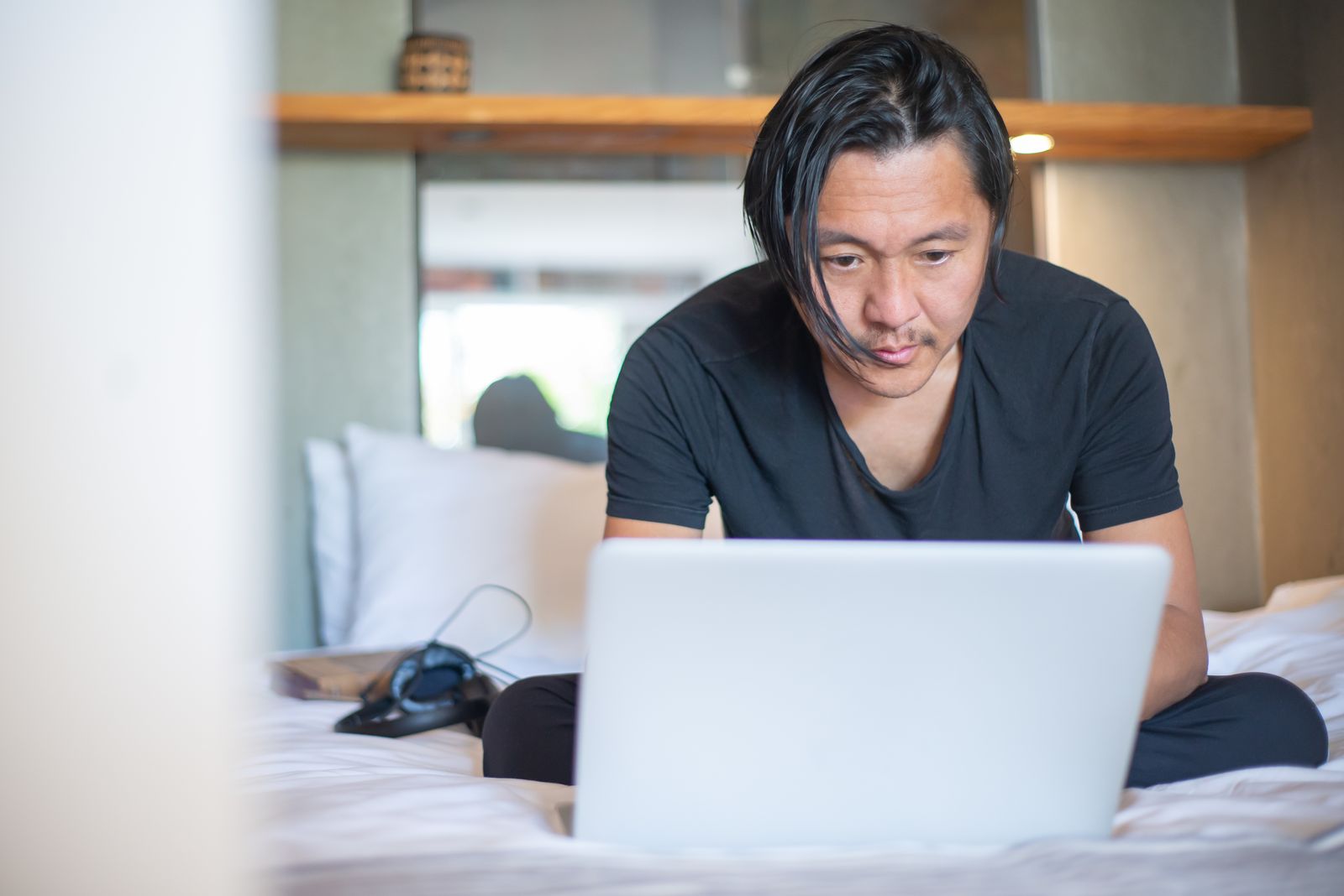 Freelancer working on a laptop from home, building an AI-assisted freelance business