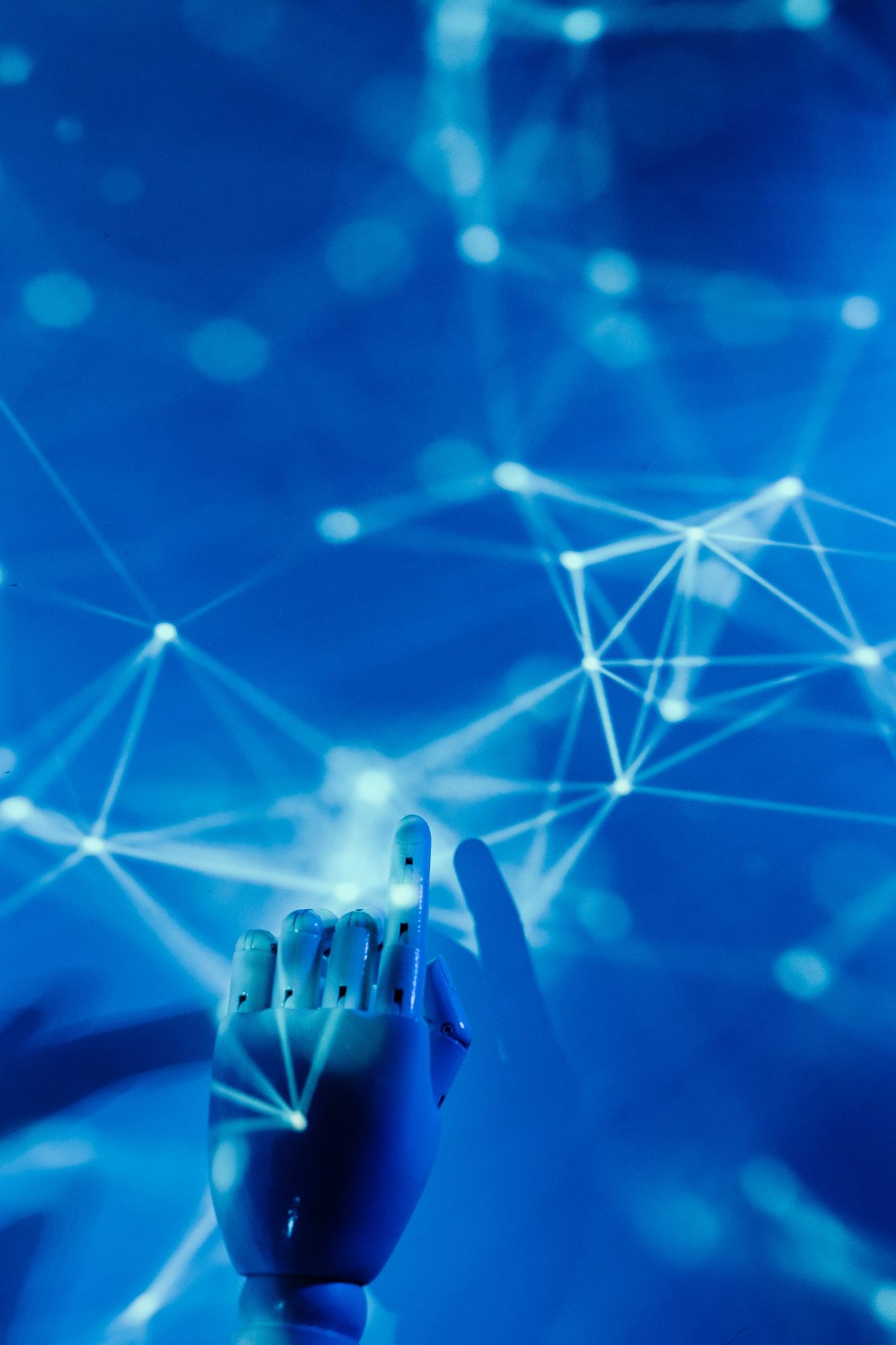 Robotic hand touching a glowing digital network, representing AI safety and alignment risk