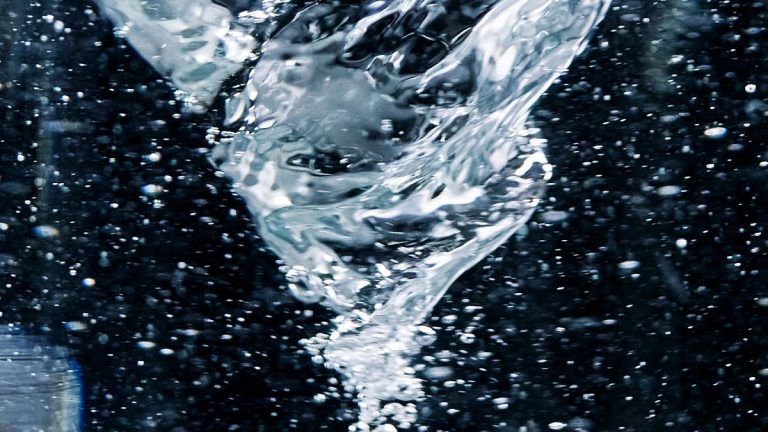 Close-up of a swirling water vortex, illustrating the spinning fluid blowup at the heart of OpenAI's Navier-Stokes proof