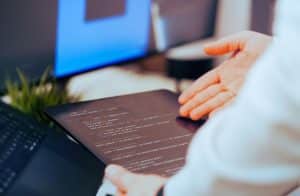 GitHub Copilot AI coding assistant review 2026 — developer reviewing code with AI agent mode